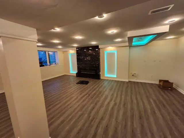 Finished basement with pot lights and LED accent lighting