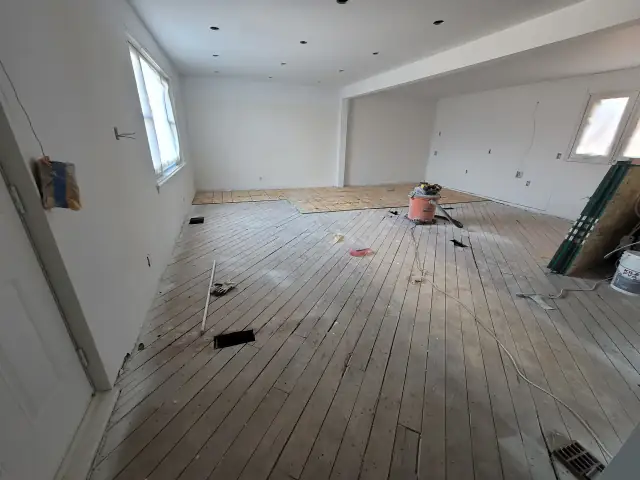 Commercial renovation with old flooring being removed